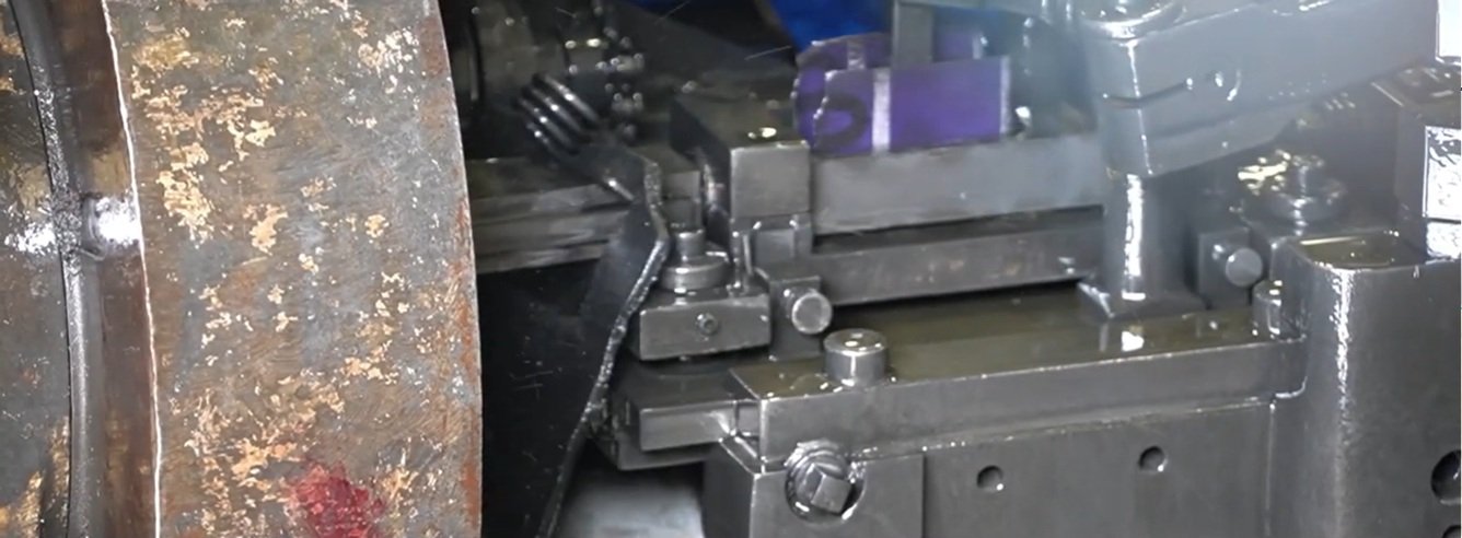 Precision tooling on a needle-forming machine